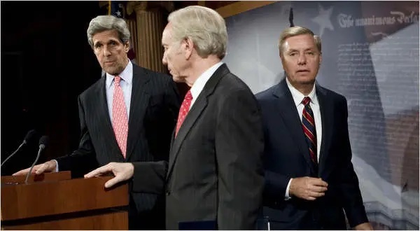 Senator Lindsey Graham, right, with Senators John Kerry and Joseph I. Lieberman at a news conference in November about proposed energy legislation. Mr. Graham sent his two colleagues a letter Saturday saying he would no longer participate in negotiations on the bill.
